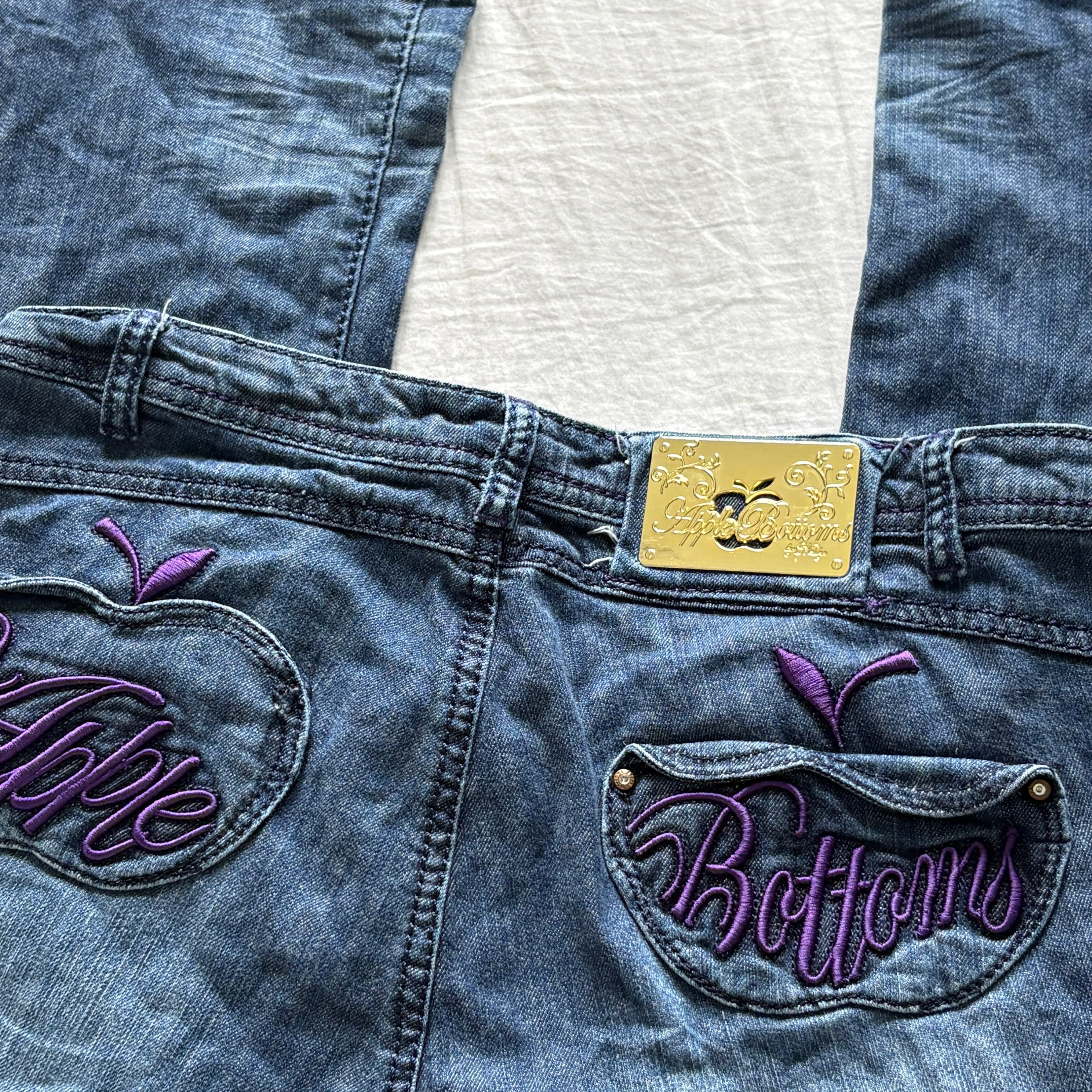 00s Apple Bottoms purple spellout jeans (size L)