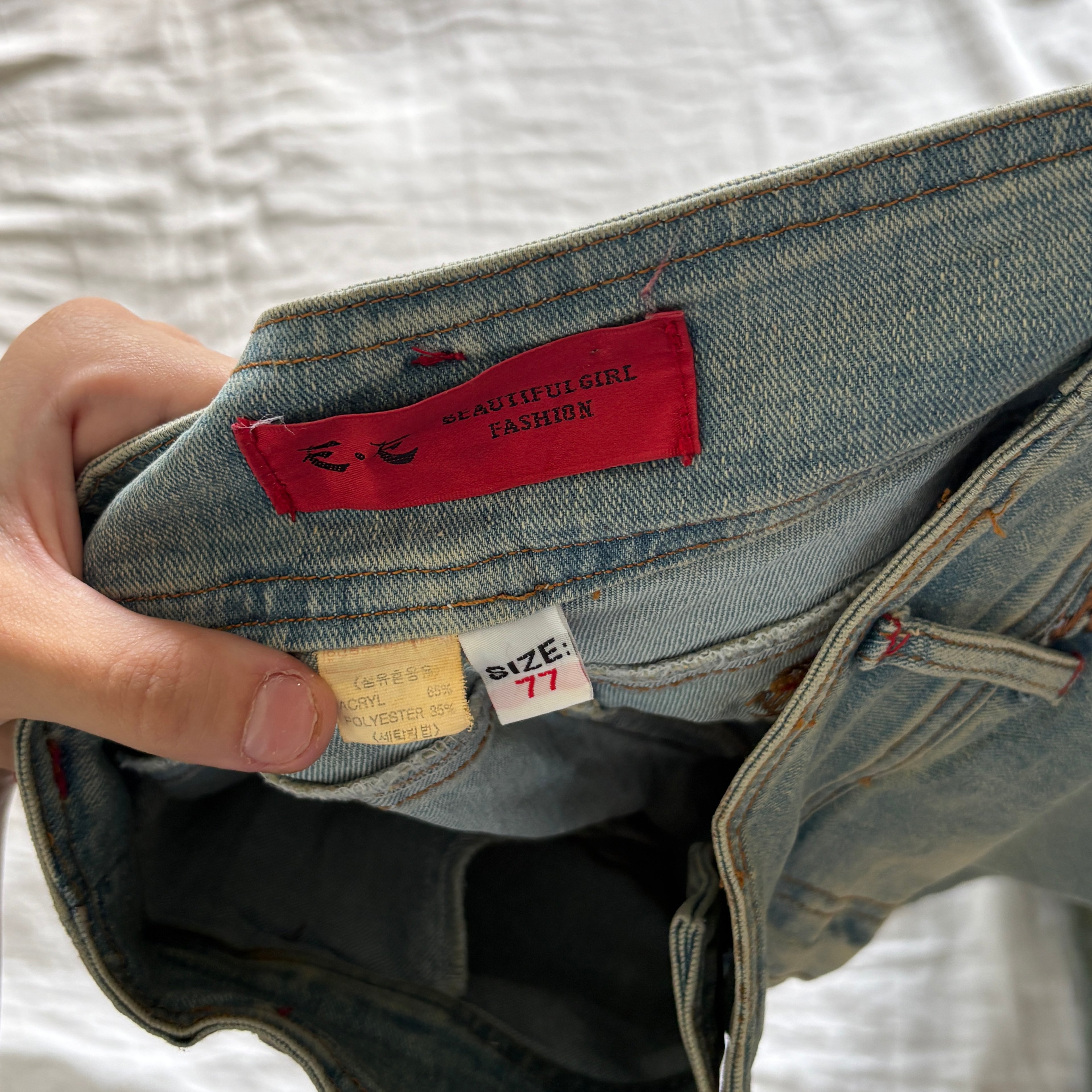 00s avant garde abstract face jeans (size S)