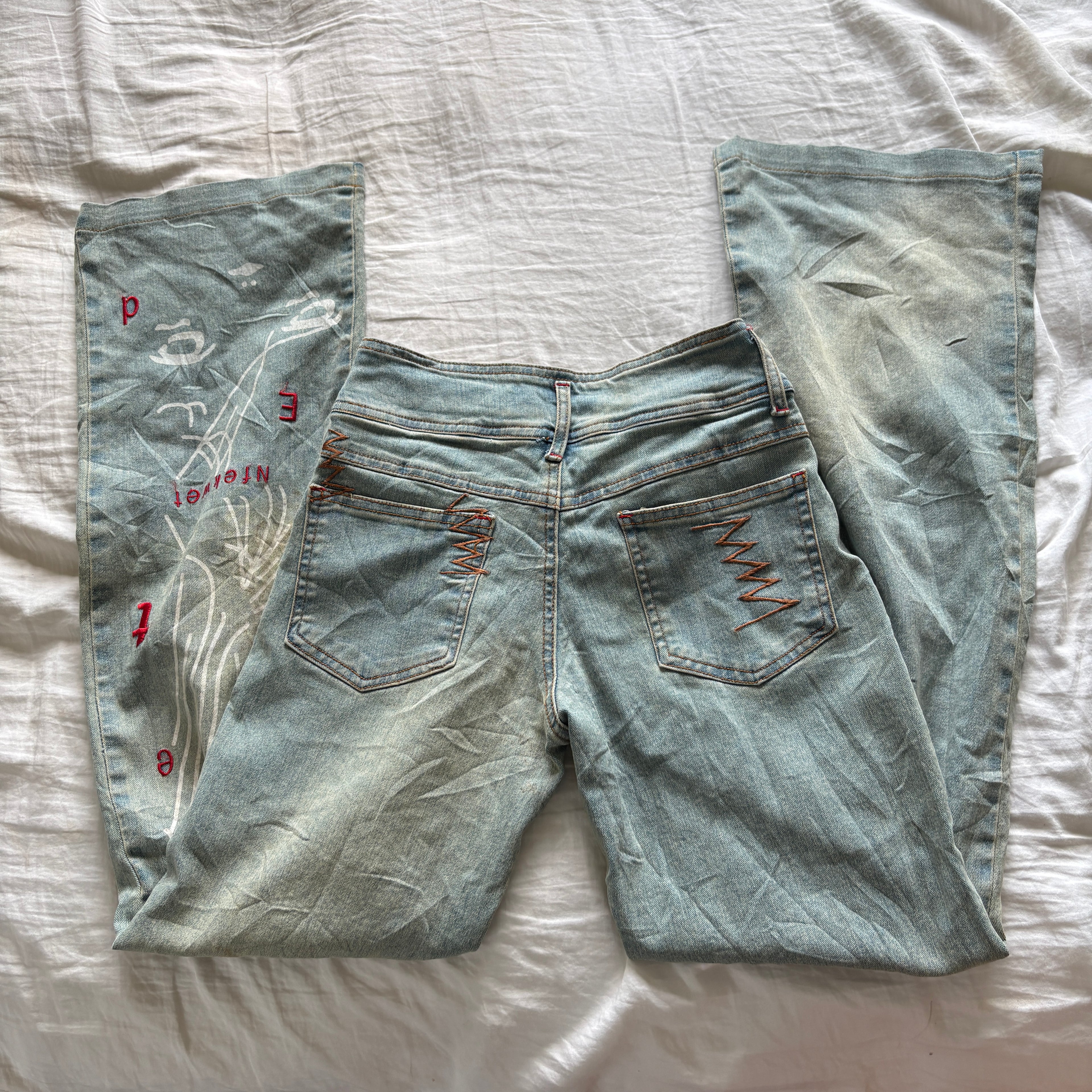 00s avant garde abstract face jeans (size S)